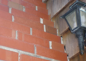 a repaired chimney in Merrill that had shown serious foundation damage and was repaired with a helical pier system.
