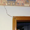 A large settlement crack on interior drywall in a West Bend home.