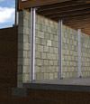 I-beam foundation wall supports installed in a Port Washington basement.