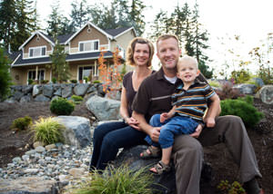 A happy family outside a home with a repaired foundation in Plymouth